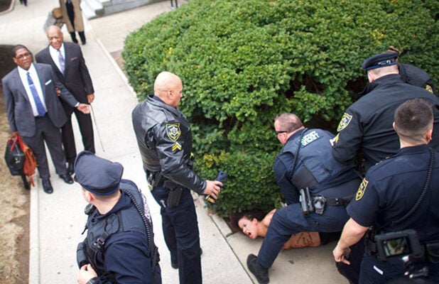 Topless Woman Charges at Bill Cosby on First Day of His Retrial (Video) image picture