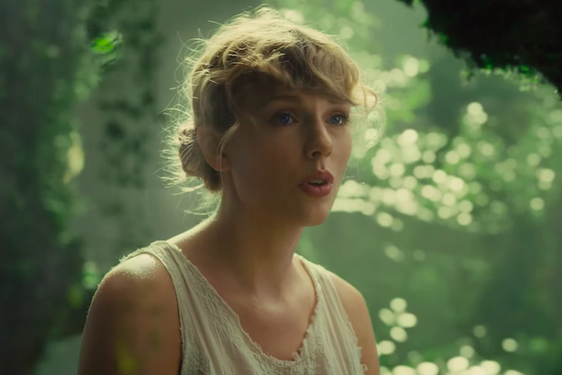 Watch Taylor Swift And Her Magical Piano Travel Through Realms In Cardigan Music Video Thewrap 