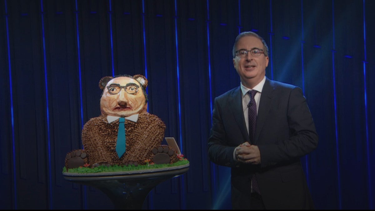 John Oliver Dives Face First Into the Butt of a John Oliver Cake Bear