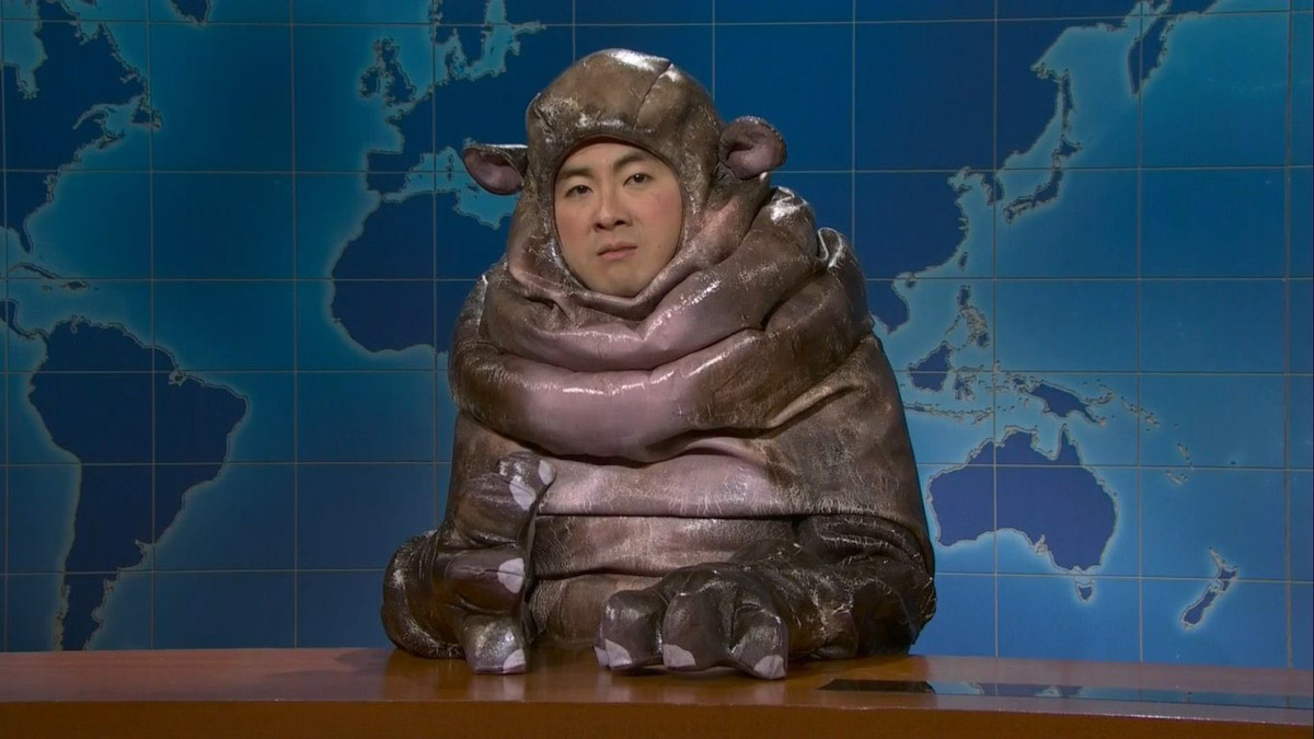 ‘SNL’: Bowen Yang Channels Chappell Roan as Moo Deng the Baby Hippo, Gets Colin Jost Hosed Down | Video